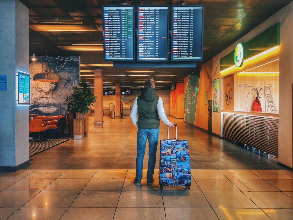 suitcase and man in airport