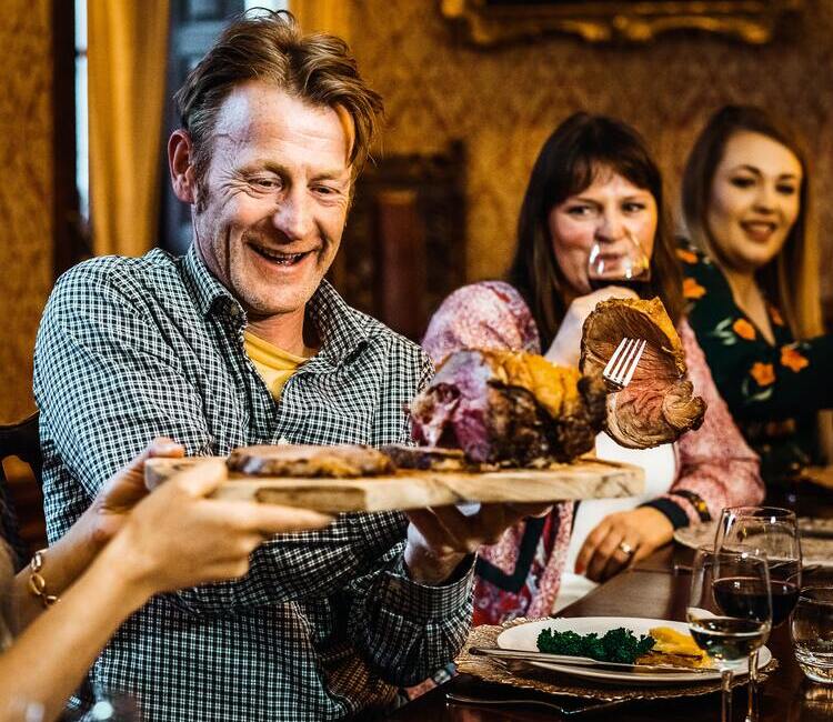 guy cutting meat