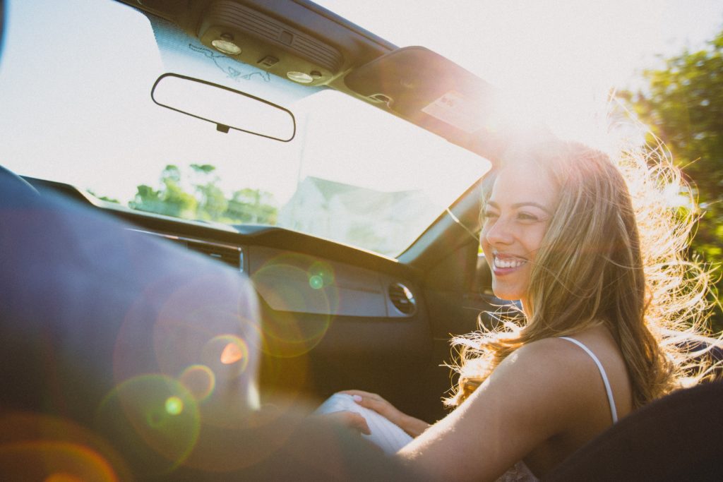 woman smiling in car